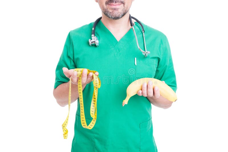 Friendly doctor holding banana and tape line stock photos Friendly doctor holding banana and tape line stock photos