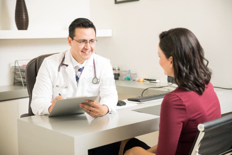 Friendly doctor talking to a patient royalty free stock photos Friendly doctor talking to a patient royalty free stock photos