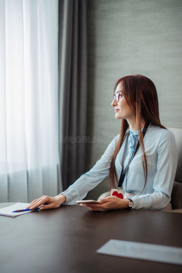 Friendly female boss gives a note to her assistant girl discussing tasks in the office. stock photography Friendly female boss gives a note to her assistant girl discussing tasks in the office. stock photography