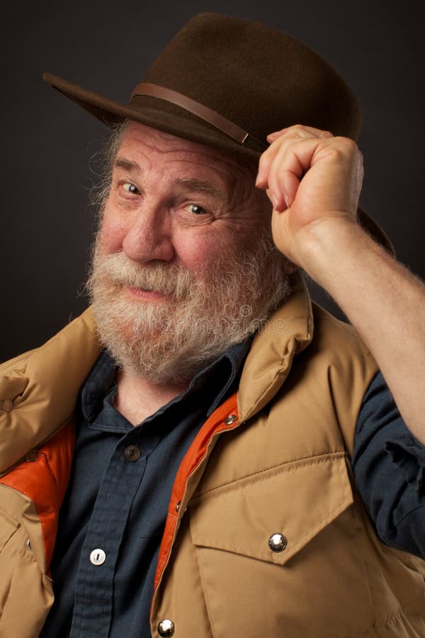 Friendly Senior Man Tipping His Hat Stock Photo Image of background