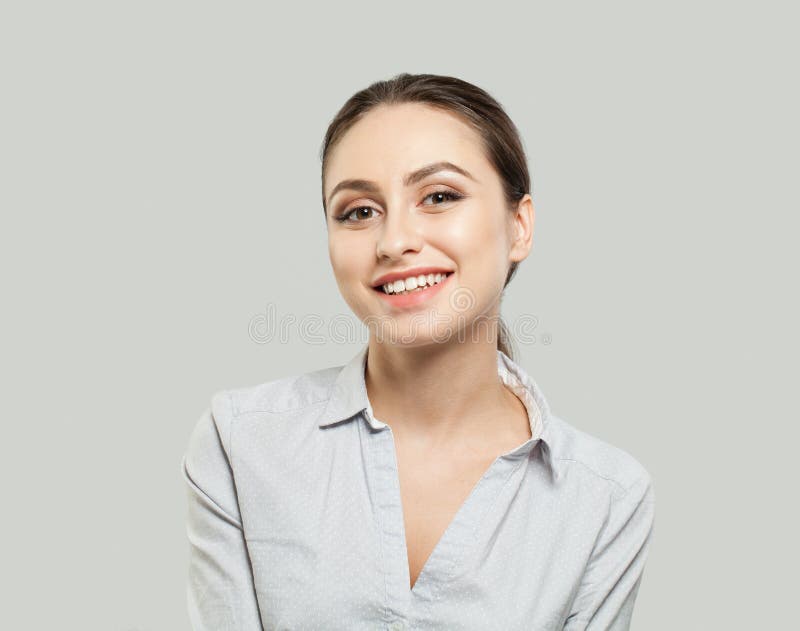 Friendly young woman smiling on white background royalty free stock photography Friendly young woman smiling on white background royalty free stock photography