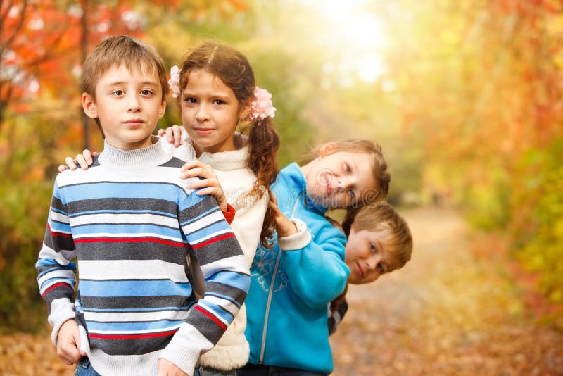 Friends in an autumn park royalty free stock photo