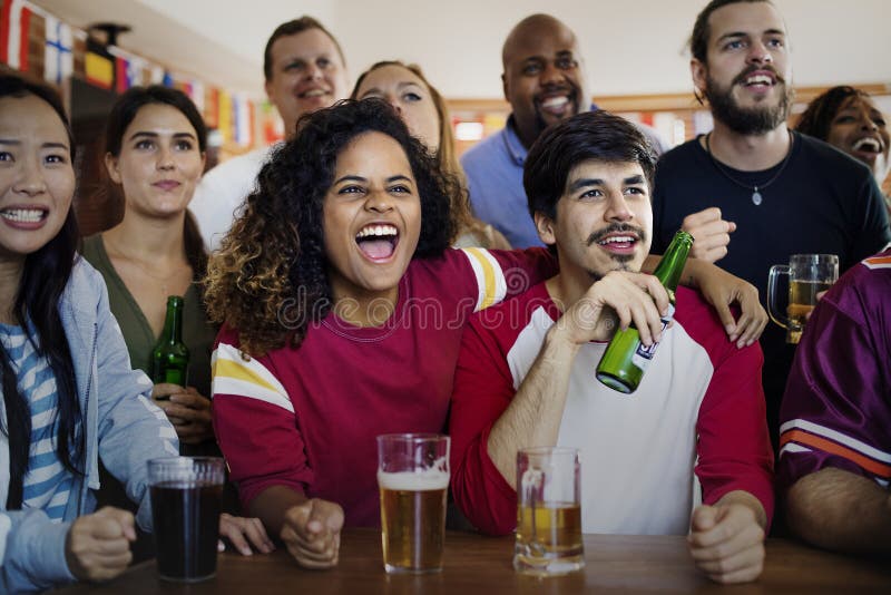 Friends cheering sport at bar together stock photo Friends cheering sport at bar together stock photo