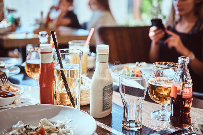 Friends Dine in the Cafe Outdoors. Close-up Image of a Table with
