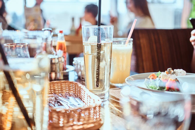 Friends Dine in the Cafe Outdoors. Close-up Image of a Table with