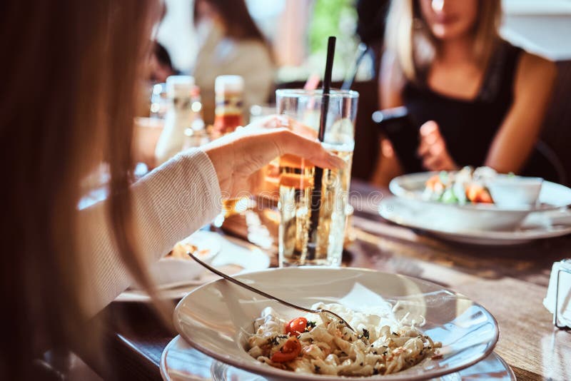 Friends Dine in the Cafe Outdoors. Close-up Image of a Table with