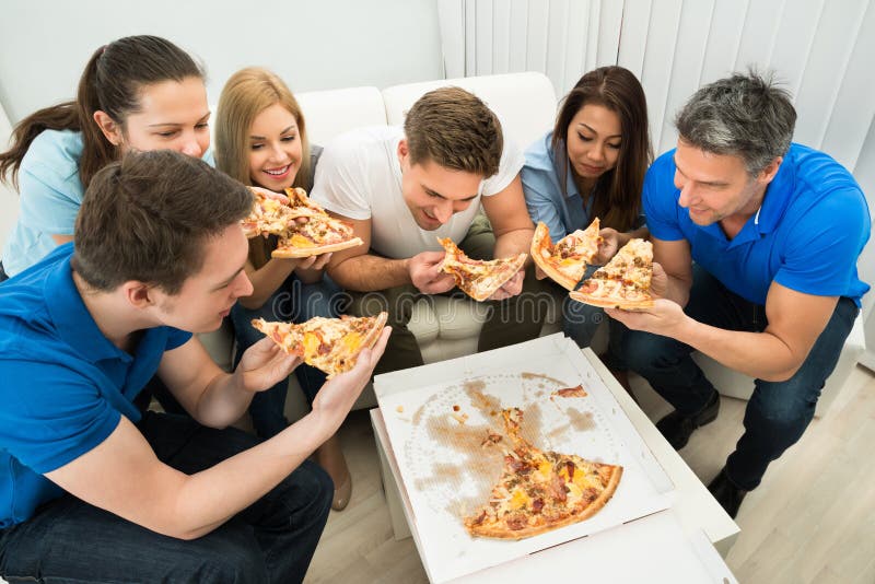 friends eating pizza together, Stock image