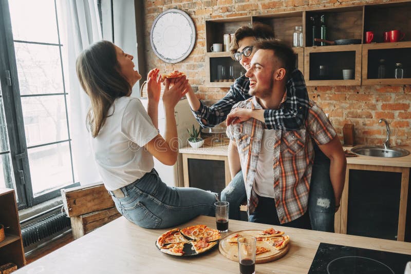 Friends Eating Pizza Together Sharing Platters Stock Photo 1038714430