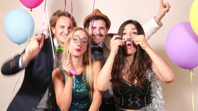 Friends enjoying in party photo booth
