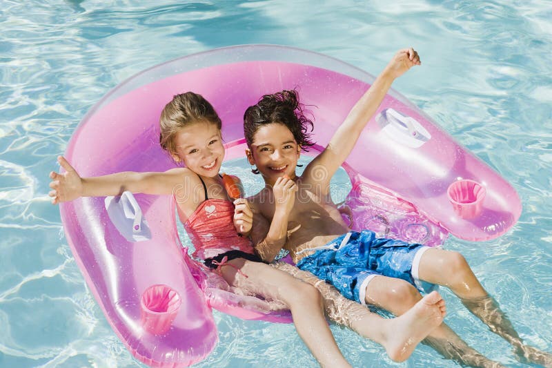 Friends Enjoying In Swimming Pool stock photography