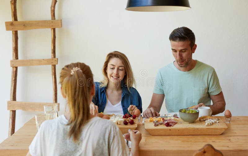 Friends having dinner stock image. Image of celebration - 112984961
