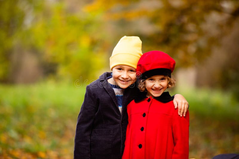 Friends play in a beautiful autumn park together stock photography