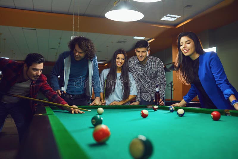 Friends Play Billiards in Bar. Stock Image Image of friendship, club