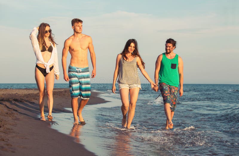 Large Group Of Young People Enjoying A Beach Party Stock Photo, Picture and  Royalty Free Image. Image 21131228.