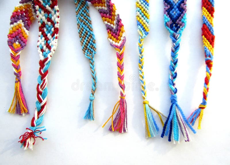 friendship bracelets made of thread with braids on white background Stock  Photo | Adobe Stock