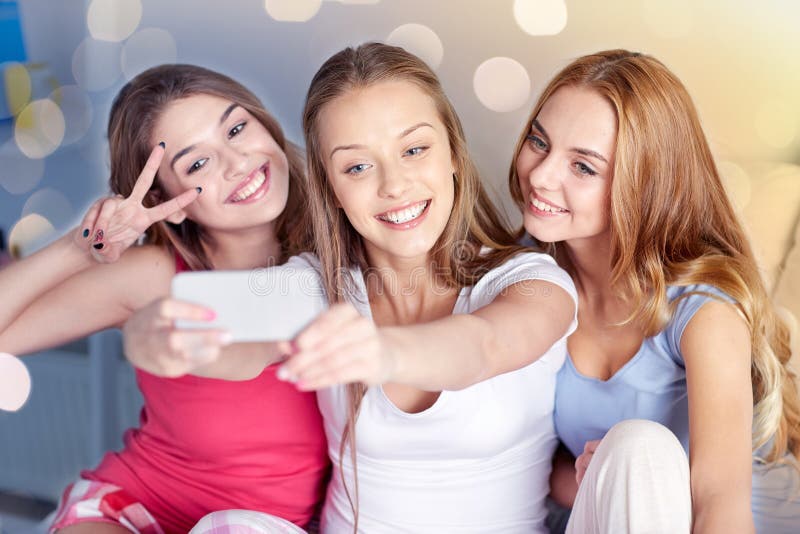 Teen Girls with Smartphone Taking Selfie at Home Stock Photo - Image of ...