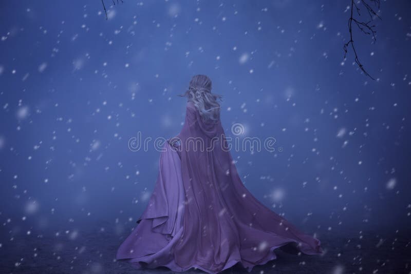 A frightened girl blonde runs in a thick fog. On the elf, a luxurious pink dress with a long train and a raincoat. There royalty free stock photo A frightened girl blonde runs in a thick fog. On the elf, a luxurious pink dress with a long train and a raincoat. There royalty free stock photo