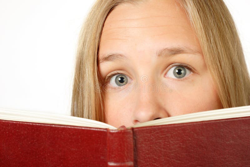 Frightened Girl looking over book
