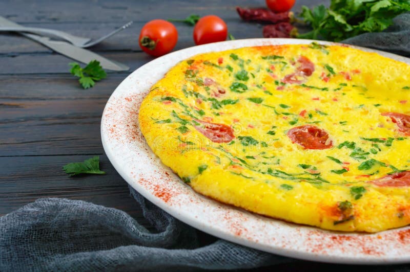 Frittata. Italian Omelette with Cheese, Greens and Tomatoes on a White ...