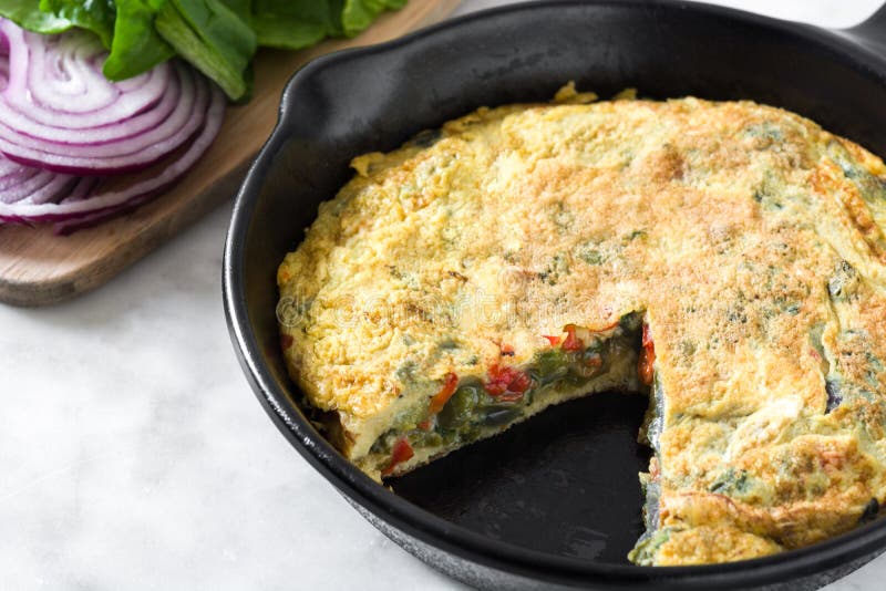 Frittata Made of Eggs and Vegetables in a Iron Pan Stock Photo Image