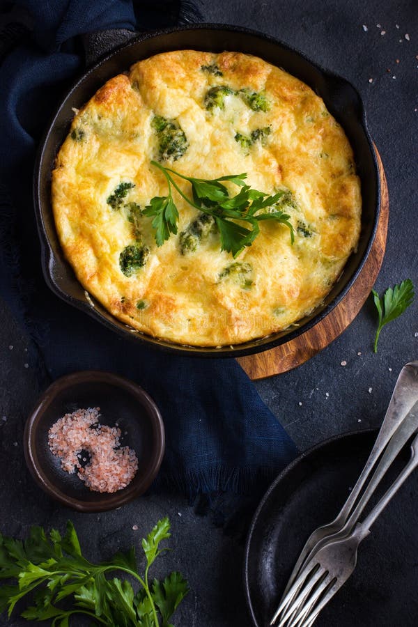 Frittata (omelette) with Vegetables and Cheese in Cast Iron Pan Stock