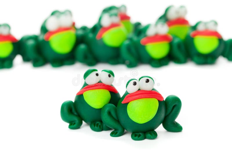 Frogs made of polymer clay isolated on white background