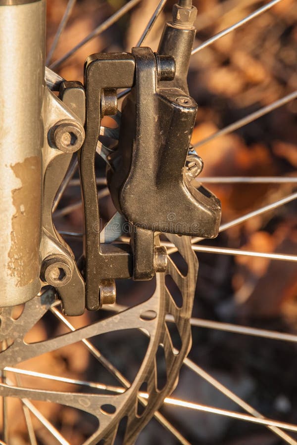 The Front Caliper of the Hydraulic Brake of the Mountain Bike Stock