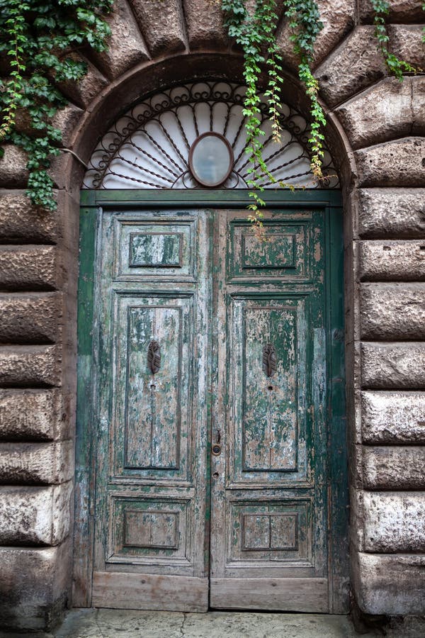 Old wooden door of a mansion in Roma city. Old wooden door of a mansion in Roma city