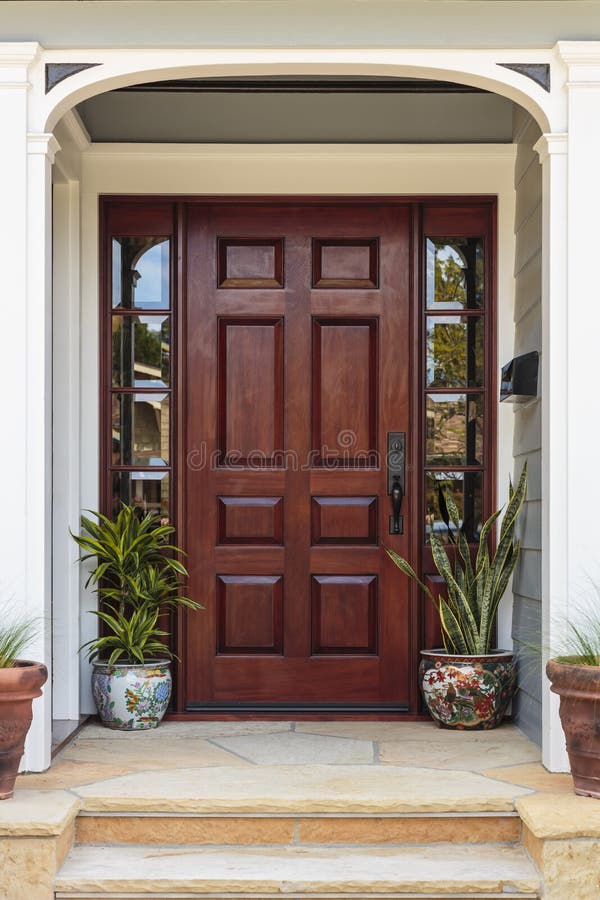 Front door, view of front door accented with plants