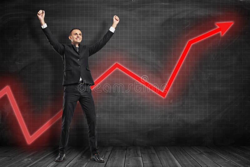 Front full length view of happy businessman raising arms in triumphant gesture with red graph arrow going up behind him royalty free stock photos Front full length view of happy businessman raising arms in triumphant gesture with red graph arrow going up behind him royalty free stock photos