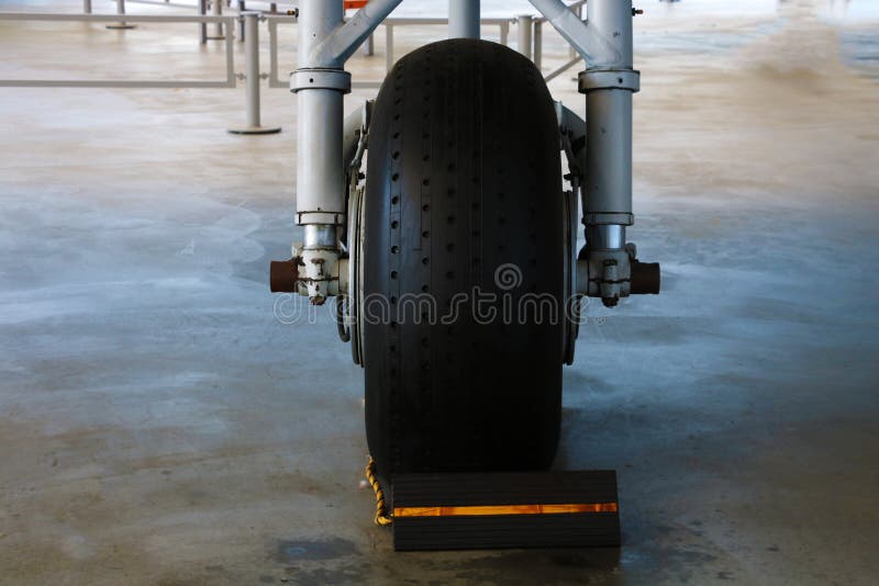 The Front Landing Gear of a Small Aircraft on the Ground Stock Image