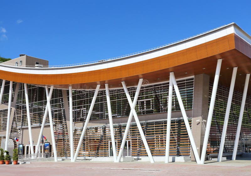 Front of large building with steel constructions