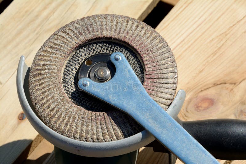Front Part of Angle Grinder with Abrasive Disc and Spanner Stock Image