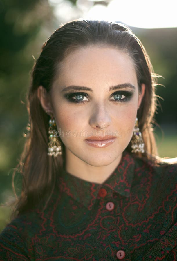 Front portrait of a charming girl with blue eyes