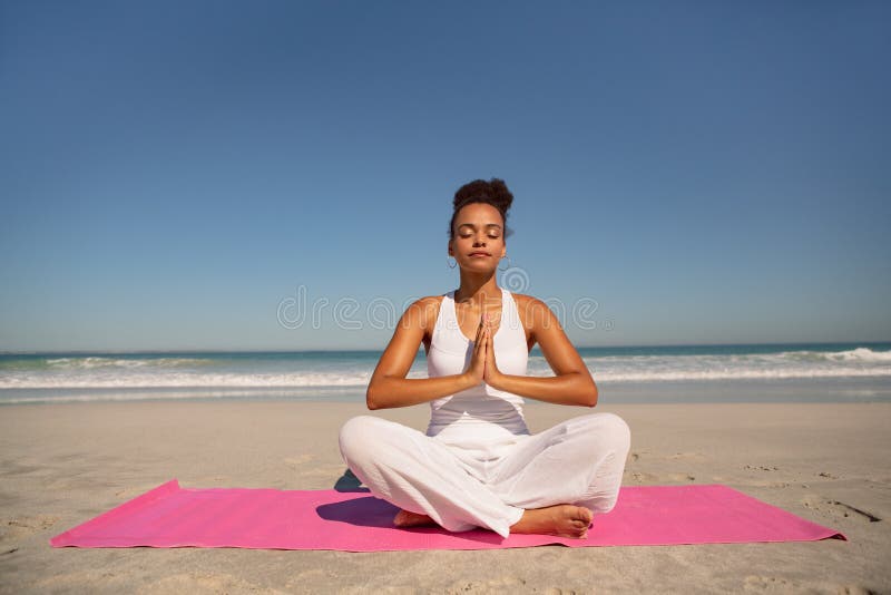https://thumbs.dreamstime.com/b/front-view-beautiful-african-american-woman-doing-yoga-exercise-mat-beach-sunshine-beautiful-woman-doing-yoga-150366344.jpg