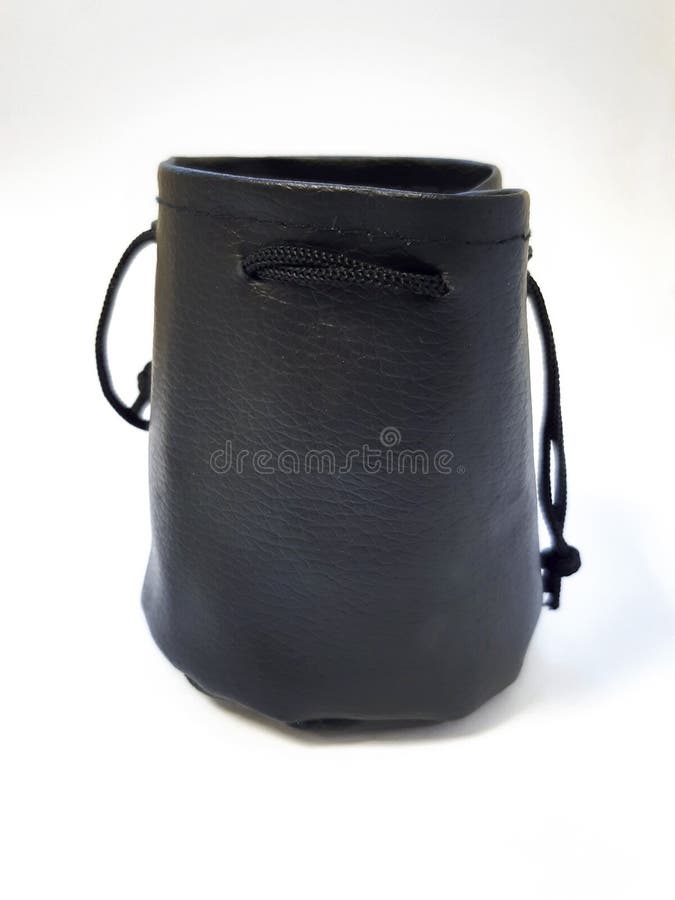 Fashion accessory close up. Front view of black leather pouch with drawstring closure. Vintage leather wallet case or pouch isolated on white background.