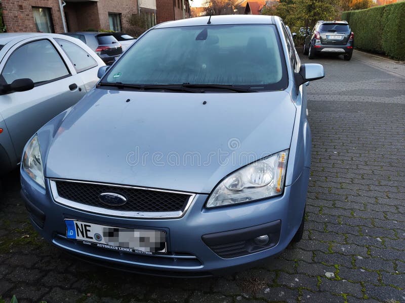 https://thumbs.dreamstime.com/b/front-view-blue-ford-focus-mk-car-parked-street-front-view-blue-ford-focus-mk-car-parked-254549117.jpg
