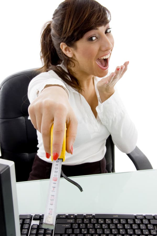 Front view of businesswoman holding measuring tape