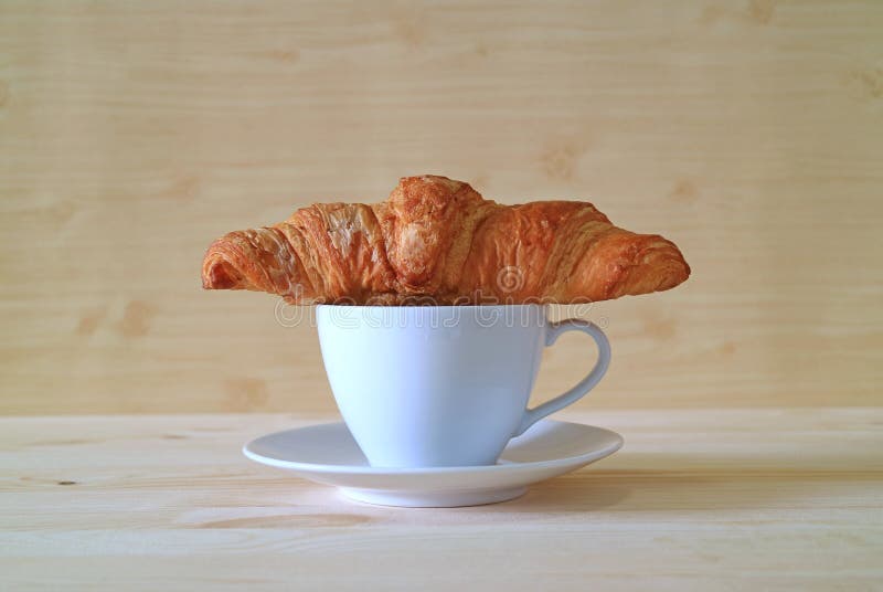 Front View of Butter Croissant with a Cup of Coffee