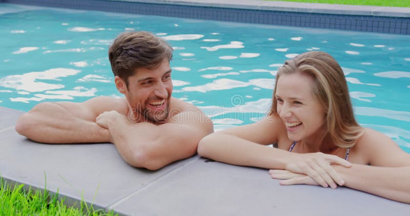 Young Couple Posing By The Swimming Pool Stock Photo | Royalty-Free |  FreeImages