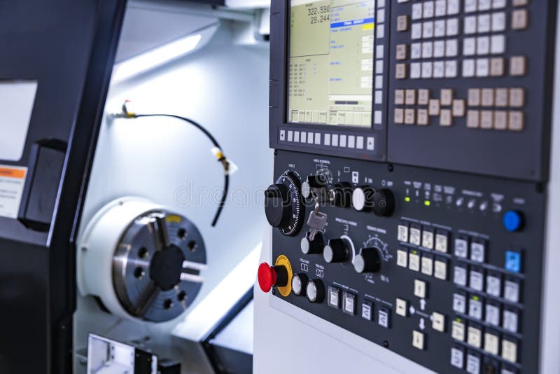Front view on cnc milling machine control panel with display.