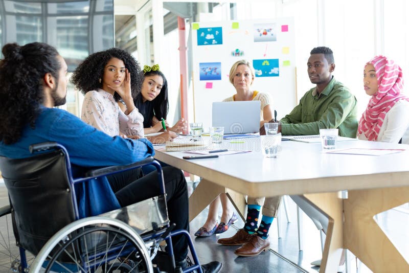 Business people discussing with each other in meeting at conference room in a modern office