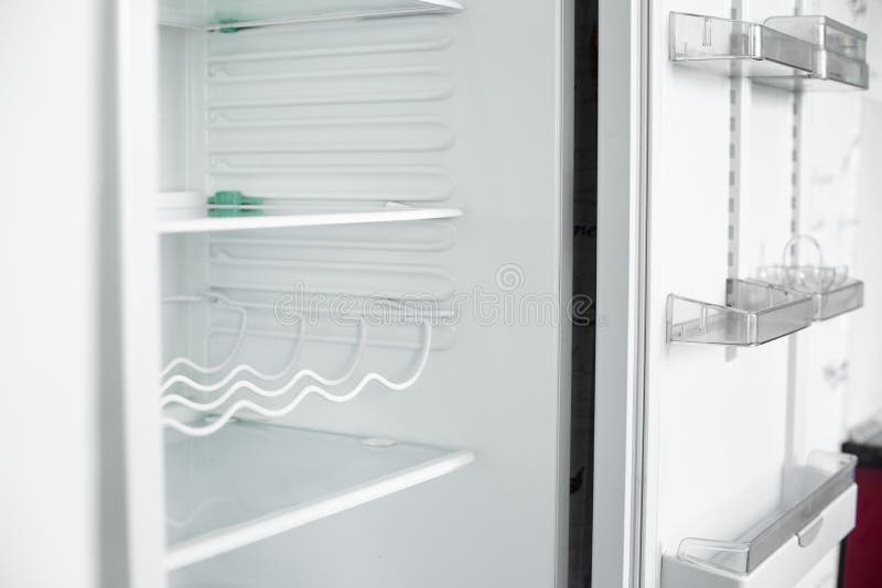 Front view of empty refrigerator staying at home stock image Front view of empty refrigerator staying at home stock image