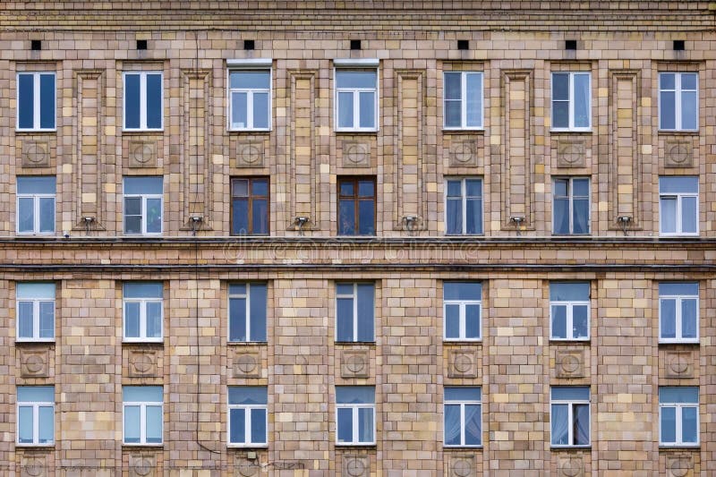 Front view on fragment of facade of a brick building