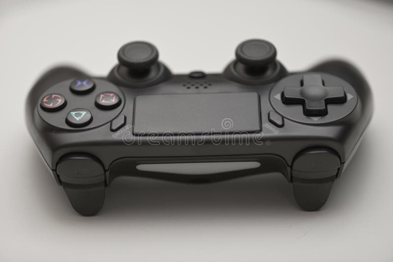 Front view of black game controller with dual analog joysticks buttons and directional pad isolated on light background for gaming royalty free stock images