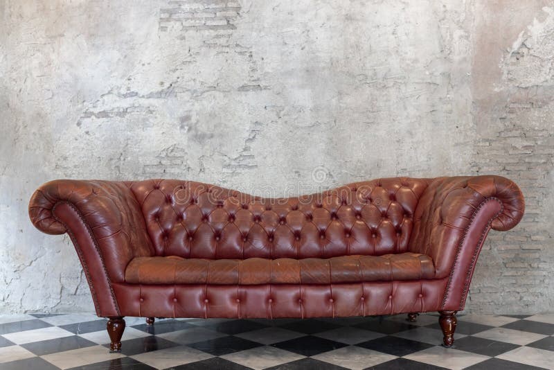 Front View of Luxury Red Leather Sofa on Checkered Pattern Marble Tiles