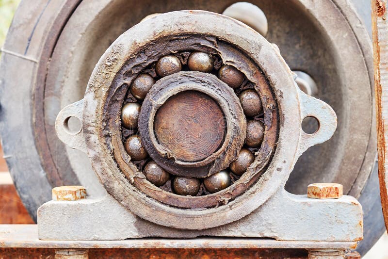 Front View of an Old Bearing on a Shaft with Old Grease Stock Photo