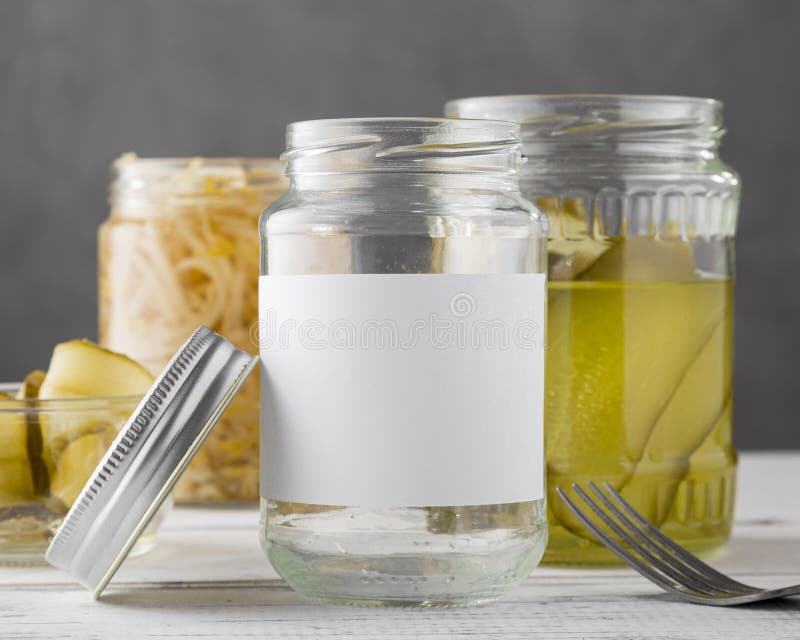 Front view pickled vegetables clear jars. High quality photo royalty free stock images