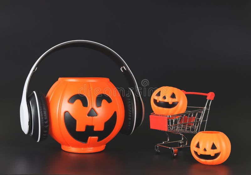 Plastic Halloween Pumpkin Bucket Cover with Headphones Isolated on Black  Background with Shopping Cart or Trolley and Stock Image - Image of  october, front: 259149339