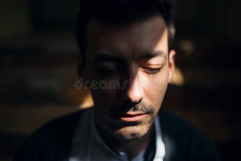A portrait of young man indoors, a close-up. stock photo